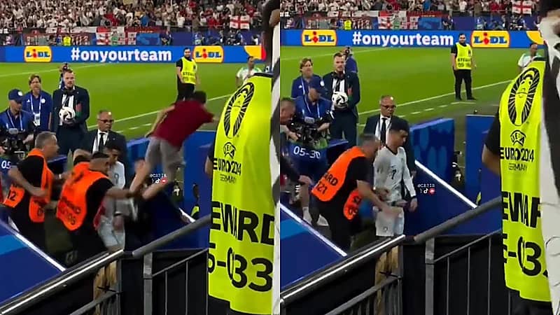 ‎مشجع يقفز بخطورة من المدرجات أمام رونالدو ويكاد يصيبه عقب مباراة البرتغال .. فيديو