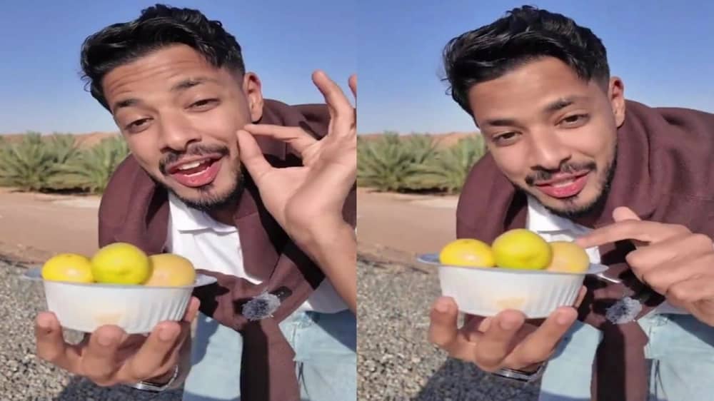 شاب يستعرض فاكهة "الكمكوات" المميزة التي تزرع في العلا.. فيديو