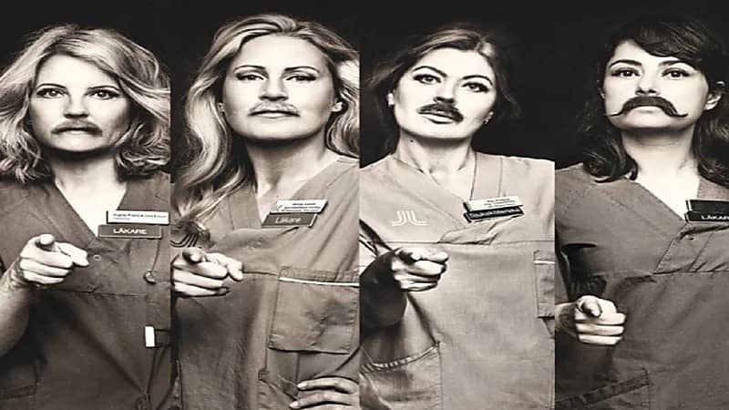 نساء يضعن شوارب مستعارة للاحتفاء باليوم العالمي للرجل