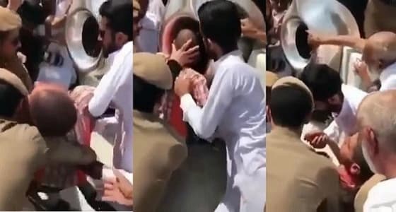 بالفيديو.. أمن الحرم يساعدون " مقعد " على تقبيل الحجر الأسود
